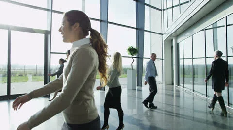 Attractive diverse business team in a light modern office building Stock Footage