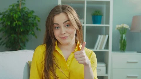 Attractive emotional happy woman show ok and super sign, posing on camera. Close Stock Footage