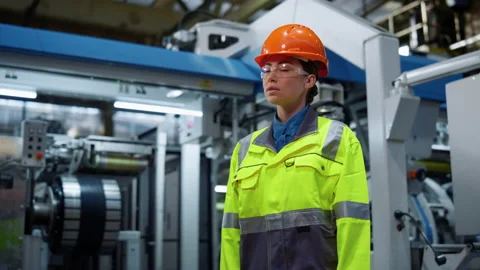 Attractive engineer look camera on manufacturing modern factory. Plant concept Stock Footage 181886462