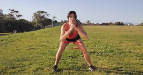 Attractive Eurasian does crab walking exercise with booty band Stock Footage 138252367