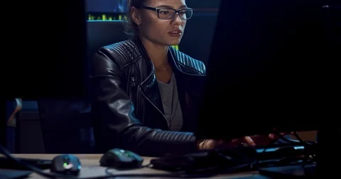 Attractive female Caucasian software developer in glasses working over the Stock Footage 124342028