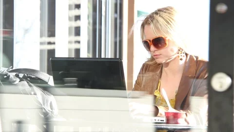 Attractive female on computer Stock Footage 1274631