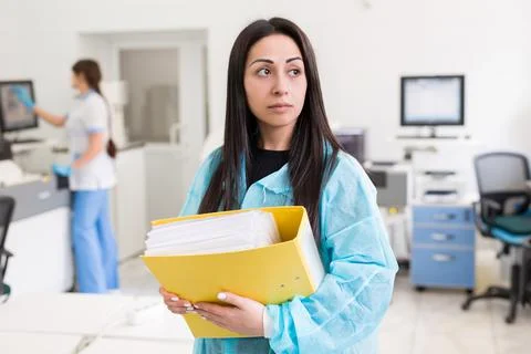 Attractive female lab worker making medical research in modern laboratory Stock Photos