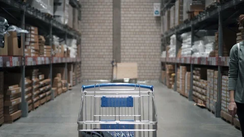 Attractive female in store is making purchases. Woman is buying furniture. Young Stock Footage 88640134