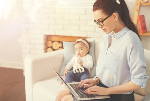 Attractive female using her computer to finish work 스톡 사진