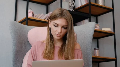 Attractive female using laptop Stock Footage 102628323