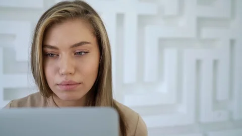 Attractive female using laptop Stock Footage 102969841