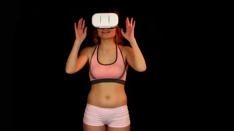 Attractive female using virtual reality headset Stock Footage 62344045