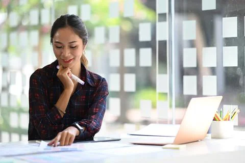 Attractive female website developer planning application development for mobile Stock Photos
