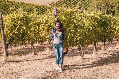 Attractive female winemaker posing in her vineyard Foto stock