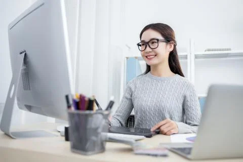 Attractive fmale designer working in office Stock Photos