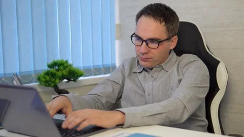 Attractive focused professional guy coding programming supporting website Stock Footage 312305639