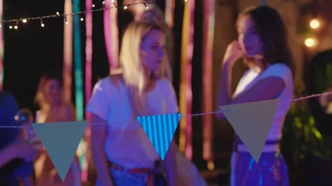 Attractive friendly girls staying on dancefloor moving into music celebrating Stock Footage 115357553