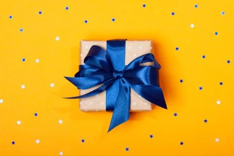 Attractive gift on the orange background Foto stock