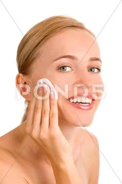Attractive girl applying face pack Stock Photos
