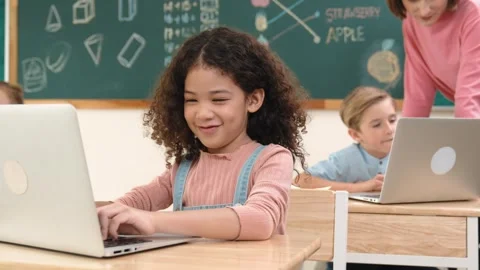 Attractive girl coding prompt while looking at camera at STEM class. Pedagogy. Stock Footage 267466932