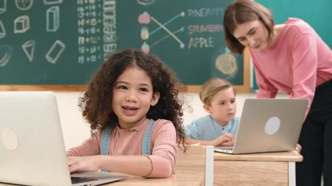 Attractive girl coding prompt while looking at camera at STEM class. Pedagogy. Stock Footage 283590640