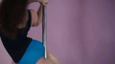 Attractive girl dancing on the pole in the dance studio Stock Footage