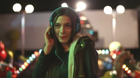 Attractive girl dancing to the rhythm of music with headphones Stock Footage 59556117