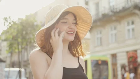 Attractive Girl Laughing while Talking on Cellphone on the Central City Area Video stock 101711205