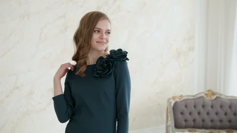 Attractive girl model posing smiling in a dress.Slow motion Video stock 129417509