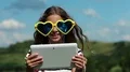 Attractive girl talks via tablet computer HD Footage