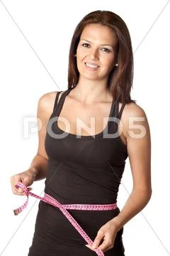 Attractive girl with tape measure Stock Photos
