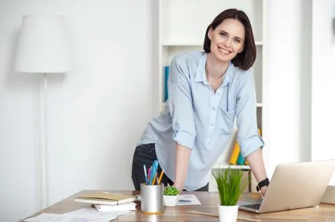 Attractive girl is using computer for work 写真素材