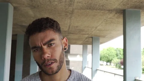 Attractive good looking aggressive mixed race black man uk council estate Stock Footage 76299593