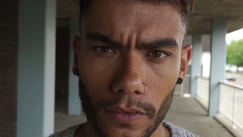 Attractive good looking aggressive mixed race black man council estate Vídeos de archivo 76299916