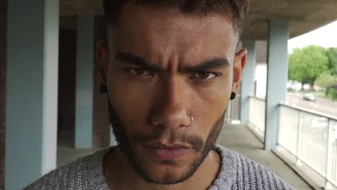 Attractive good looking agressive mixed race black man council estate staring 스톡 동영상 76299893