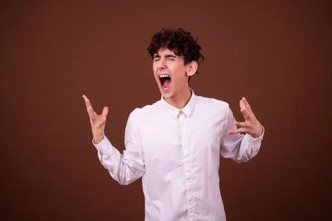 An attractive guy has different emotions. Foto stock