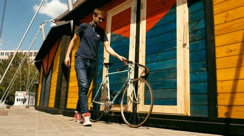 Attractive guy rest with bicycle Stock Footage 63363859