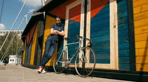Attractive guy rest with bicycle Stock Footage 63365893