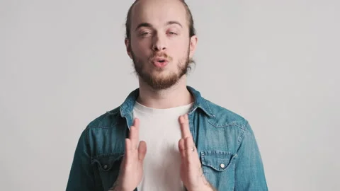 Attractive guy taking deep breath showing namaste Stock Footage 150342827