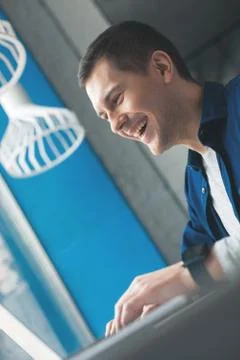 Attractive guy is working on a computer Stock Photos