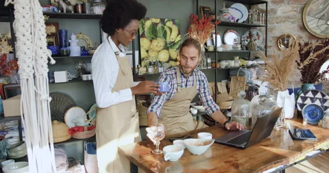 Attractive hardworking in good mood 30-aged multiracial coworkers revisioning Stock Footage 143963752