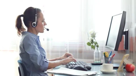 Attractive helpdesk consultant talking on headset Stock Footage 8607935