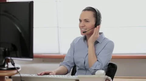 Attractive helpdesk consultant talking on headset HD Stock Footage 22020965
