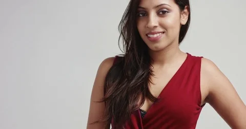 Attractive hispanic model in dark red dress Stock Footage 82279658