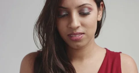 Attractive hispanic model in dark red dress Stock Footage 82279731