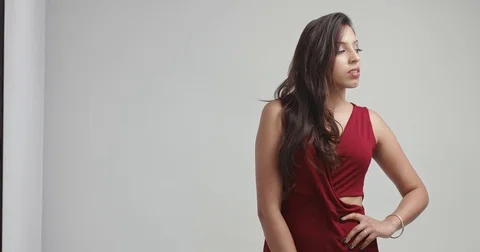 Attractive hispanic model in dark red dress Stock Footage 82279737