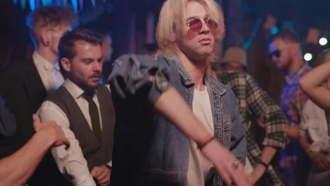 Attractive joyful blonde boy dancing with robotic moves talented peformance Stock Footage 115368859
