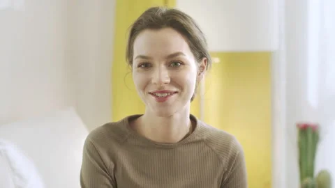 An attractive lady is looking to the camera and talking Stock Footage 156302036