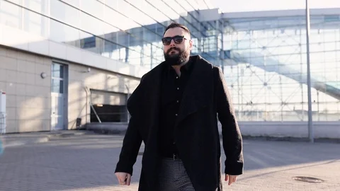 Attractive man with a beard and briefcase dancing in the street Stock Footage 122034516