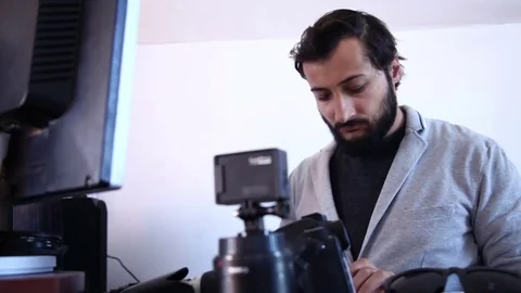 Attractive man with a beard and mustache works on the computer Video stock 76436048