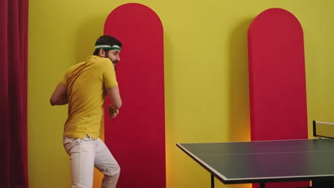 Attractive man catch the balls on the ping pong game and getting excited that he Stock Footage 183524302