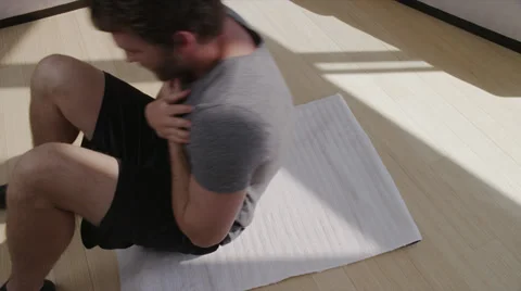 Attractive Man Does Sit-Ups Stock Footage
