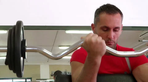 Attractive man doing exercise with barbell Video stock 30468090