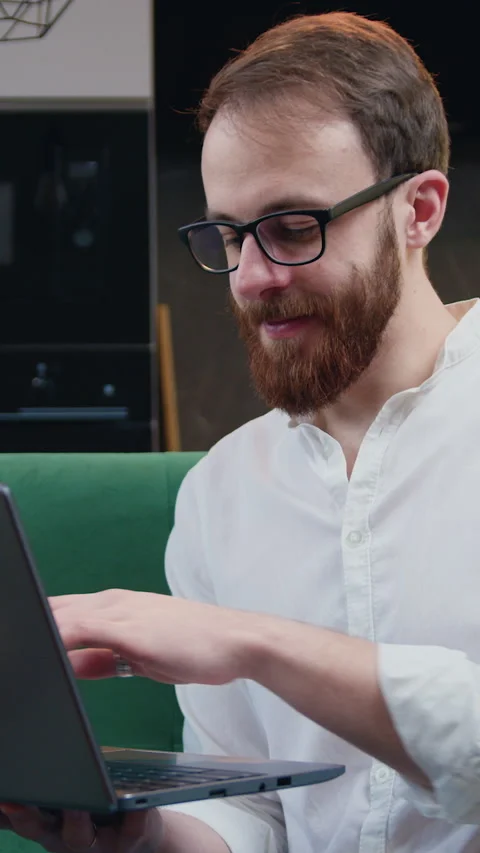 Attractive man engaged in software engineering working from home, concentrating  Stock Footage 333328311